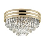 Lampa sufitowa Naica 5-punktowa w kolorze złotym i chromowanym, z kryształowymi zwisami, o okrągłym kształcie. Widoczna elegancka metalowa oprawa z trzema złotymi paskami. Idealna do nowoczesnych wnętrz.