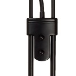 Czarna lampa podłogowa Champion LED z dwoma punktami świetlnymi. Widać centralny uchwyt z dwoma przyciskami oraz elastyczny przewód. Produkt ukazany z bliska, bez tła, podkreślający detale konstrukcyjne.