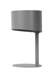 Lampa stołowa Knulle 1-punktowa w kolorze szarym. Posiada cylindryczny klosz i stabilną okrągłą podstawę. Ujęcie frontalne, produkt stoi na płaskiej powierzchni, podkreślając minimalistyczny design.