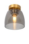 Lampa sufitowa Tyler IP44 o jednym punkcie świetlnym, wykonana z mosiądzu. Szklany klosz w odcieniu szaro-przezroczystym, z widoczną żarówką. Ujęcie z dołu, ukazujące kształt klosza oraz detal mocowania do sufitu.
