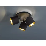 Trzy punktowa lampa sufitowa Tommy w kolorze czarnym, z tekstylnymi kloszami, zamocowana na okrągłej podstawie. Klosze skierowane są w różnych kierunkach, emitując ciepłe światło. Idealna do nowoczesnych wnętrz.