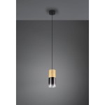 Lampa wisząca Robin w kolorze czarnym z mosiężnym akcentem, o cylindrycznym kształcie. Zawieszona na cienkim, czarnym kablu, z przezroczystym kloszem. Wykończenie matowe, idealna do nowoczesnych wnętrz.