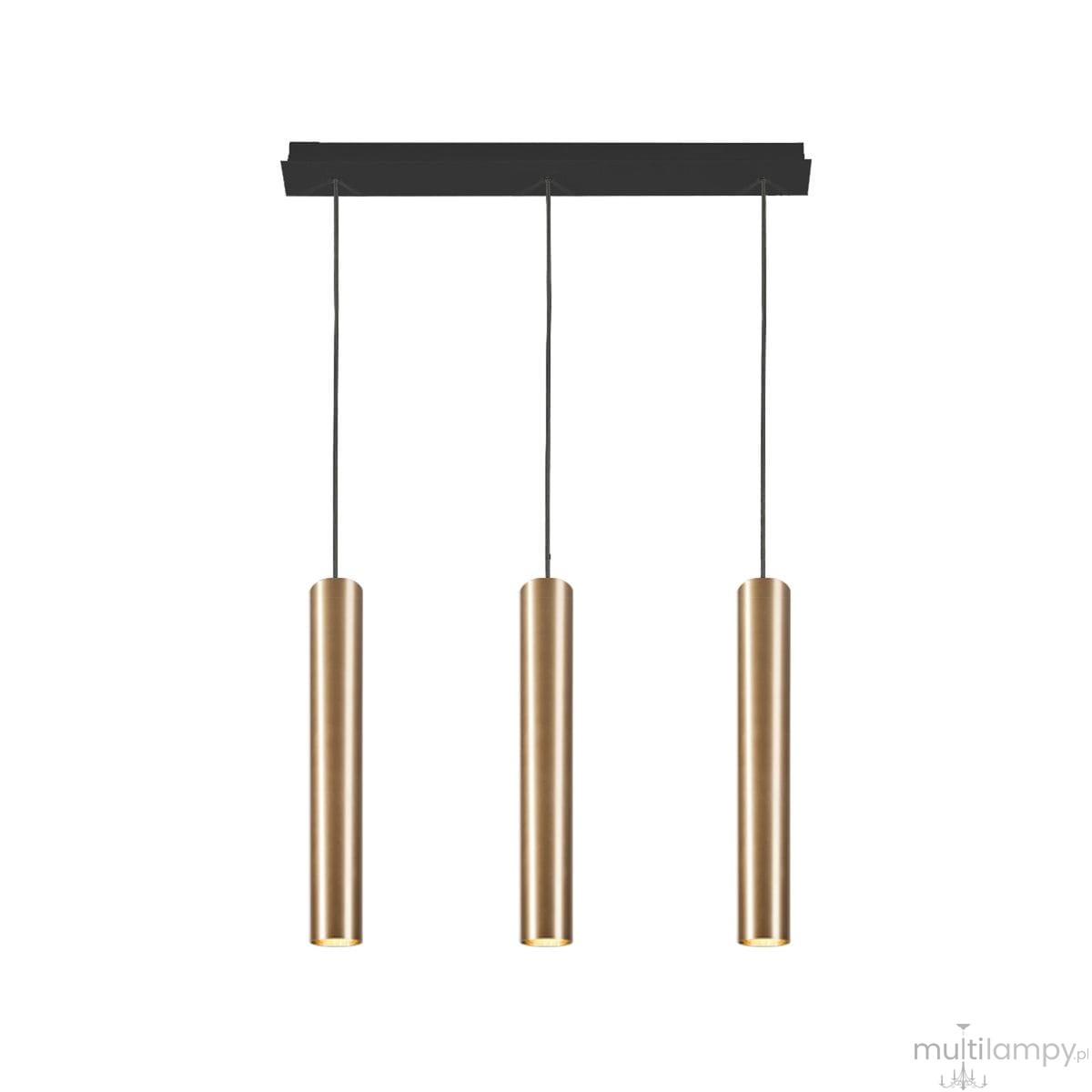 Lampa wisząca Eye w kolorze mosiądzu z trzema cylindrycznymi kloszami, zawieszona na czarnej listwie sufitowej. Klosze mają matowe wykończenie i są zawieszone na cienkich linkach. Tło białe, co podkreśla elegancki design.