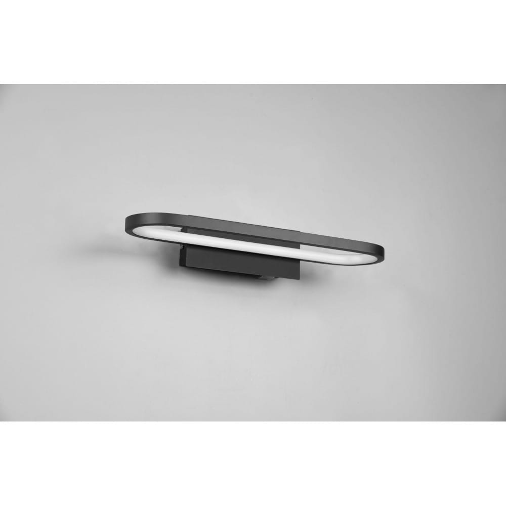 Kinkiet łazienkowy Gianni LED IP44 w kolorze czarnym, o wymiarach L40 cm i mocy 17W. Montowany na ścianie, z prostokątną, matową obudową oraz delikatnym podświetleniem LED wzdłuż krawędzi. Tło jest jasne, co podkreśla design.