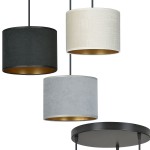 Lampa wisząca Hilde 3-punktowa z trzech cylindrycznych kloszy: czarnego, szarego i beżowego, z metalowym wykończeniem w kolorze złotym wewnątrz. Klosze zawieszone na cienkich linkach z czarnym stelażem, ułożone w poziomie, na prostokątnej podstawie.