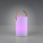 Lampa stołowa ogrodowa Aruba LED w białym kolorze, cylindryczna, z brązowym uchwytem. Emituje delikatne, zmieniające się kolory światło, umieszczona na szarej powierzchni. Idealna do użytku na zewnątrz.