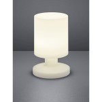 Lora LED lampa stołowa ogrodowa w białym kolorze, z cylindrycznym kloszem i okrągłą podstawą. Ujęcie frontalne, lampa leży na szarej powierzchni, emituje miękkie światło, idealna do użytku na zewnątrz.