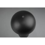 Czarna lampa stołowa LED Lennon o okrągłym kształcie, widoczna z góry. Posiada niewielki przycisk włączania w kolorze białym na górze. Lampa wykonana z matowego materiału, idealna do użytku w ogrodzie.
