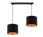 Lampa wisząca Candida 2-punktowa w kolorze czarnym, z cylindrycznymi kloszami oraz miedzianym wnętrzem. Zawieszona na prostokątnej, czarnej podstawie. Klosze wiszą w równych odstępach, oferując nowoczesny design.