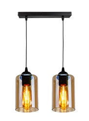 Czarna lampa wisząca 2-punktowa z przezroczystymi kloszami, zawieszona na cienkich linkach. Klosze mają kształt cylindryczny, a widoczne żarówki emitują ciepłe światło. Montaż na prostokątnej podstawie.