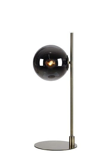 Lampa stołowa Dione 1-punktowa z mosiężnym stelażem i dymionym kloszem. Okrągła, szklana czasza w ciemnym kolorze na prostym, metalowym słupku. Stabilna podstawa w kształcie okręgu. Wysoka, nowoczesna forma idealna do biura lub salonu.