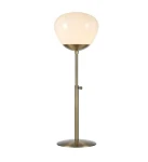 Lampa stołowa Rise 1-punktowa w antycznym mosiądzu z białym kloszem. Stojąca, z metalową podstawą i regulowanym ramieniem. Klosz o zaokrąglonym kształcie, lekko przezroczysty, umieszczony na wysmukłej nodze.