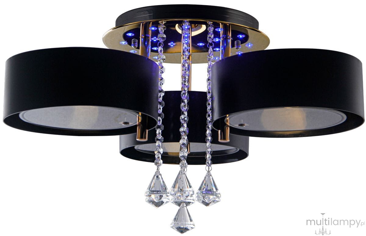 Lampa sufitowa Antila E27 w kolorze złotym i czarnym, 3-punktowa, z pilotem. Posiada trzy cylindryczne klosze, ozdobne kryształowe elementy oraz podświetlenie LED. Ujęcie z dołu, produkt zamontowany na suficie.