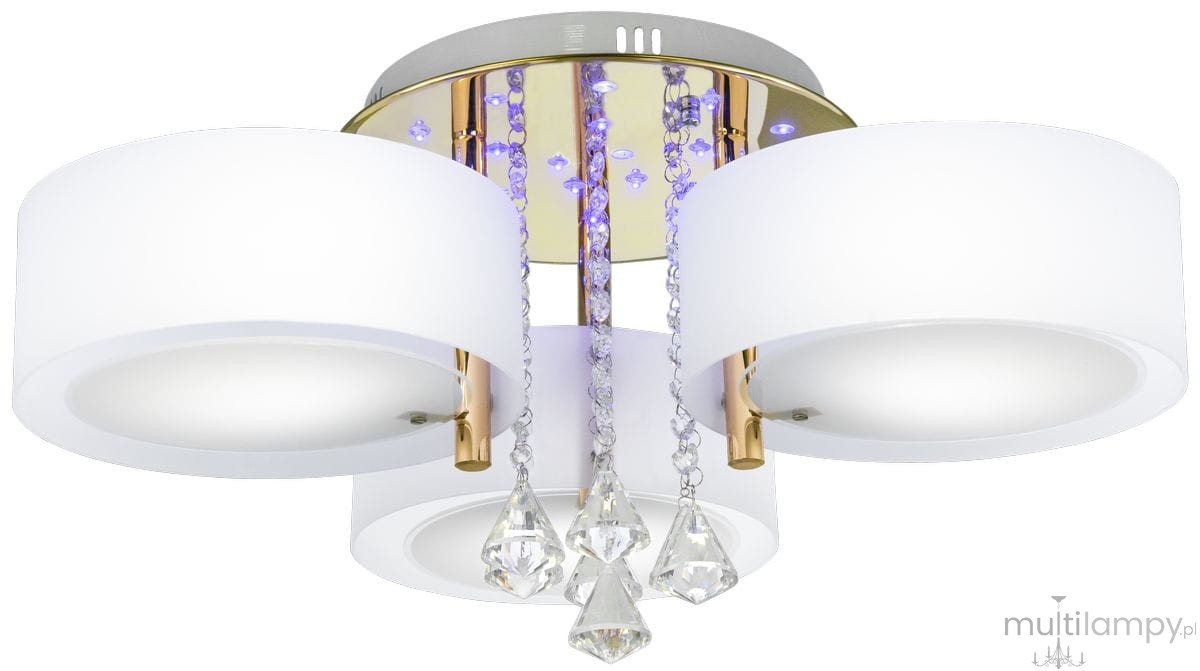 Lampa sufitowa Antila E27 3-punktowa w kolorze złotym i białym, z okrągłymi kloszami oraz dekoracyjnymi kryształkami. Ujęcie frontalne, produkt zamontowany na suficie, z pilotem do zdalnego sterowania.
