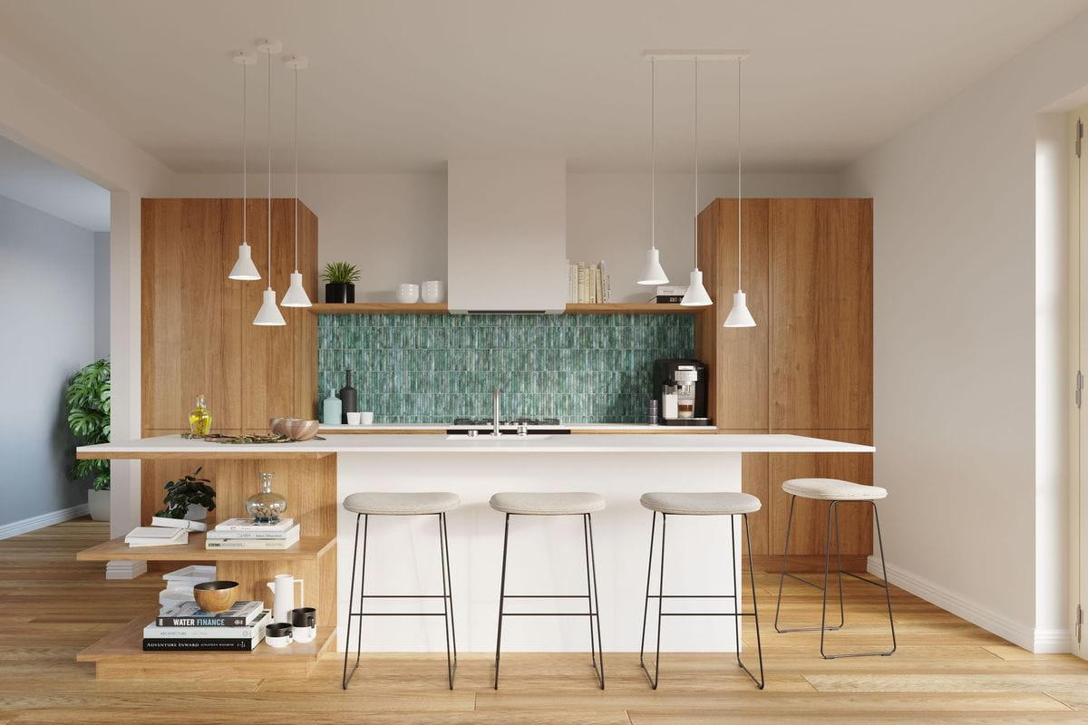 Lampa wisząca 1-punktowa w kolorze białym, zawieszona nad wyspą kuchenną. Ma prosty, minimalistyczny kształt. W tle widoczna zielona płytka na ścianie oraz drewniane meble, a także trzy stołki barowe z jasnymi siedziskami.
