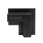 Łącznik kątowy do szyn magnetycznych, czarny, wykonany z materiału gips-karton. Zbliżenie na produkt w kształcie litery L, z widocznymi oznaczeniami CE i RoHS, stojący na płaskiej powierzchni. Krawędzie ostre, powierzchnia matowa.