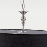 Lampa wisząca Abu Dhabi 5-punktowa, z chromowanym detalem i czarnym abażurem. Ujęcie z góry, ukazujące mocowanie, metalowy element i górną część klosza. Abażur ma teksturowaną powierzchnię, a całość ma elegancki, nowoczesny wygląd.