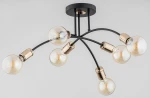 Lampa wisząca Lanti 6-punktowa w kolorze czarnym i złotym. Konstrukcja z elastycznymi ramionami, na których umieszczone są sześć okrągłych żarówek. Montaż sufitowy, widoczny metalowy uchwyt. Tło jasne, minimalistyczne.