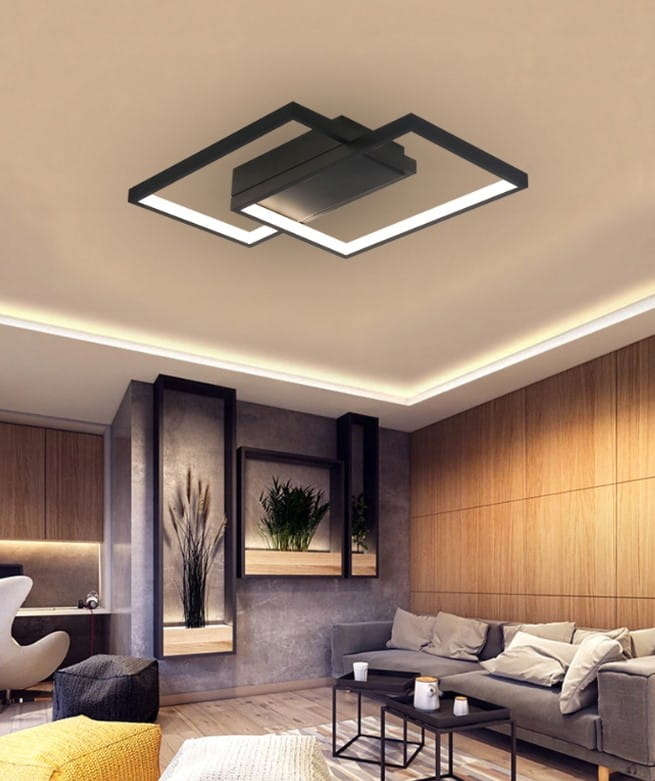 Czarna lampa sufitowa Galaxis Polaris LED 45W z dwoma punktami świetlnymi i pilotem, zamontowana na suficie w nowoczesnym wnętrzu. Kształt prostokątny, z delikatnym podświetleniem, idealna do salonu.
