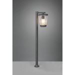 Lampa ogrodowa stojąca Cavado H100 w kolorze antracytowym, z przezroczystym kloszem, umieszczona na prostym słupku. Widok frontalny, oświetlona żarówka wewnątrz klosza. Tło w odcieniu szarości, podstawa stabilna.