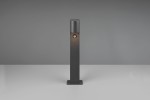 Lampa stojąca ogrodowa Roya H50 w kolorze antracytowym, z czujnikiem ruchu, o prostokątnym kształcie. Ujęcie frontalne, produkt stoi na płaskiej powierzchni. Źródło światła umieszczone w górnej części lampy. Tło jednolite, szare.