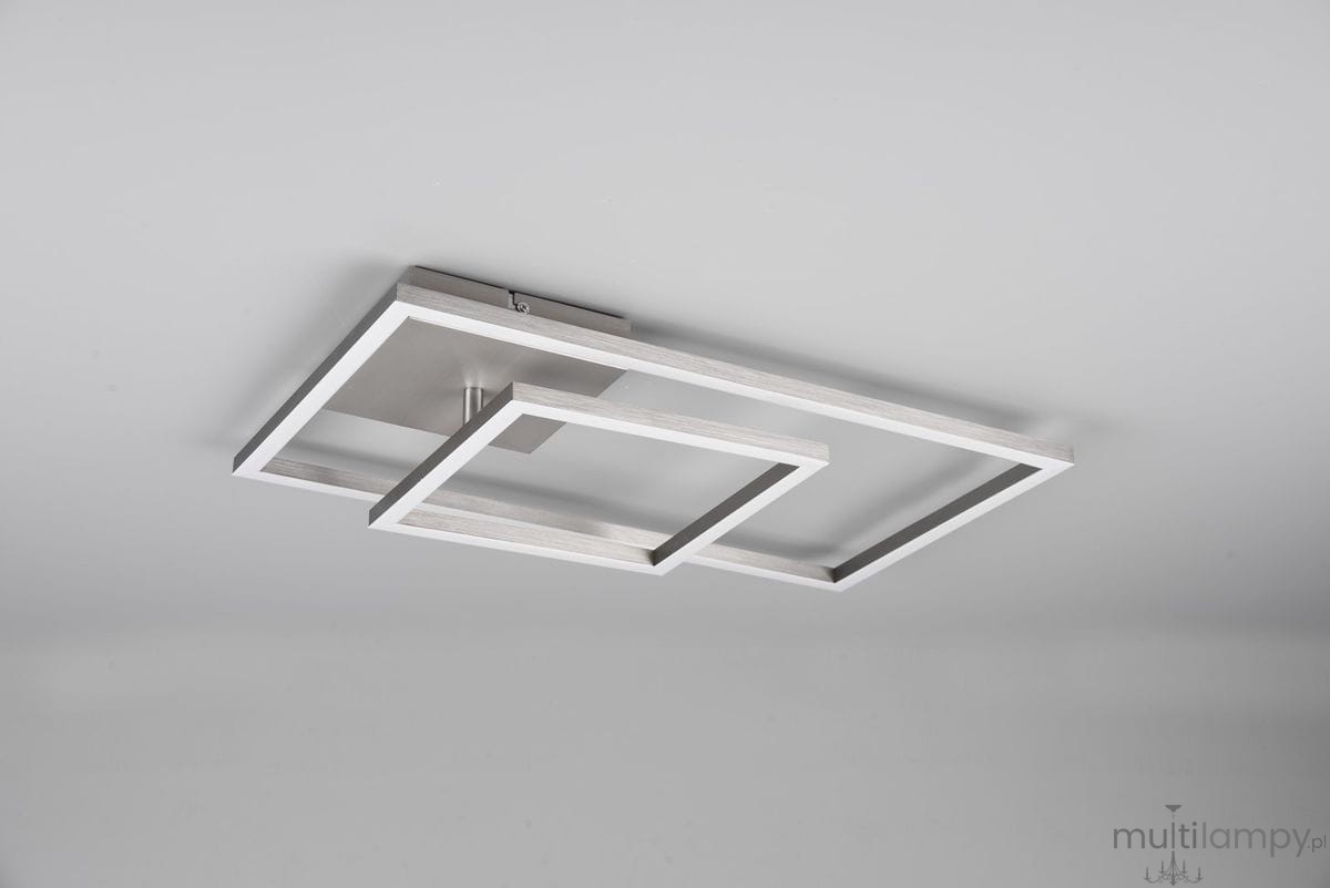Lampa sufitowa Padella LED 4000K w kolorze niklowym, z dwoma prostokątnymi ramkami w białym kolorze, zamontowana na suficie. Kąt ujęcia z dołu, ukazujący nowoczesny design i unikalne połączenie geometrycznych kształtów.