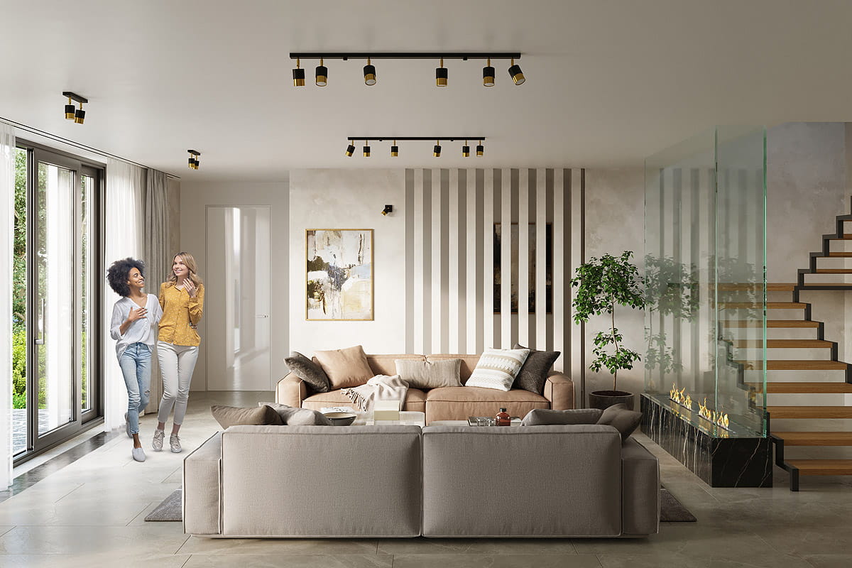 Czarna lampa sufitowa Nero z dwoma punktami świetlnymi, z pozłacanymi detalami. Ujęcie z góry, ukazuje nowoczesny design lampy w aranżacji wnętrza z kanapą, roślinami oraz dużymi oknami, w jasnym i przestronnym pomieszczeniu.