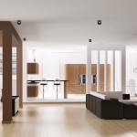 Czarna, okrągła oprawa do zabudowy Bali Round 1-punktowa, zamontowana w suficie, w minimalistycznym wnętrzu. Widoczna w nowoczesnej kuchni z brązowymi meblami i jasnym tłem.