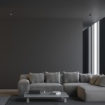 Czarna oprawa do zabudowy Bali Round 1-punktowa, umieszczona w sufitowej aranżacji. Widać minimalistyczny styl, z tłem w odcieniach szarości oraz nowoczesnym meblem. Dobrze komponuje się z wystrojem wnętrza.