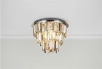 Lampa sufitowa Clarissa 5-punktowa w chromie z kryształowymi elementami. Okrągła, montowana na suficie, z wiszącymi kryształami w różnych odcieniach, emitującymi ciepłe światło. Prosta, elegancka forma, idealna do nowoczesnych wnętrz.