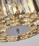 Lampa wisząca Chapeau 3-punktowa w kolorze chromu, z ozdobnymi kryształkami w złotym odcieniu. Widoczny okrągły element mocujący z metalowymi kulkami oraz refleksy świetlne na szklanych detalach.