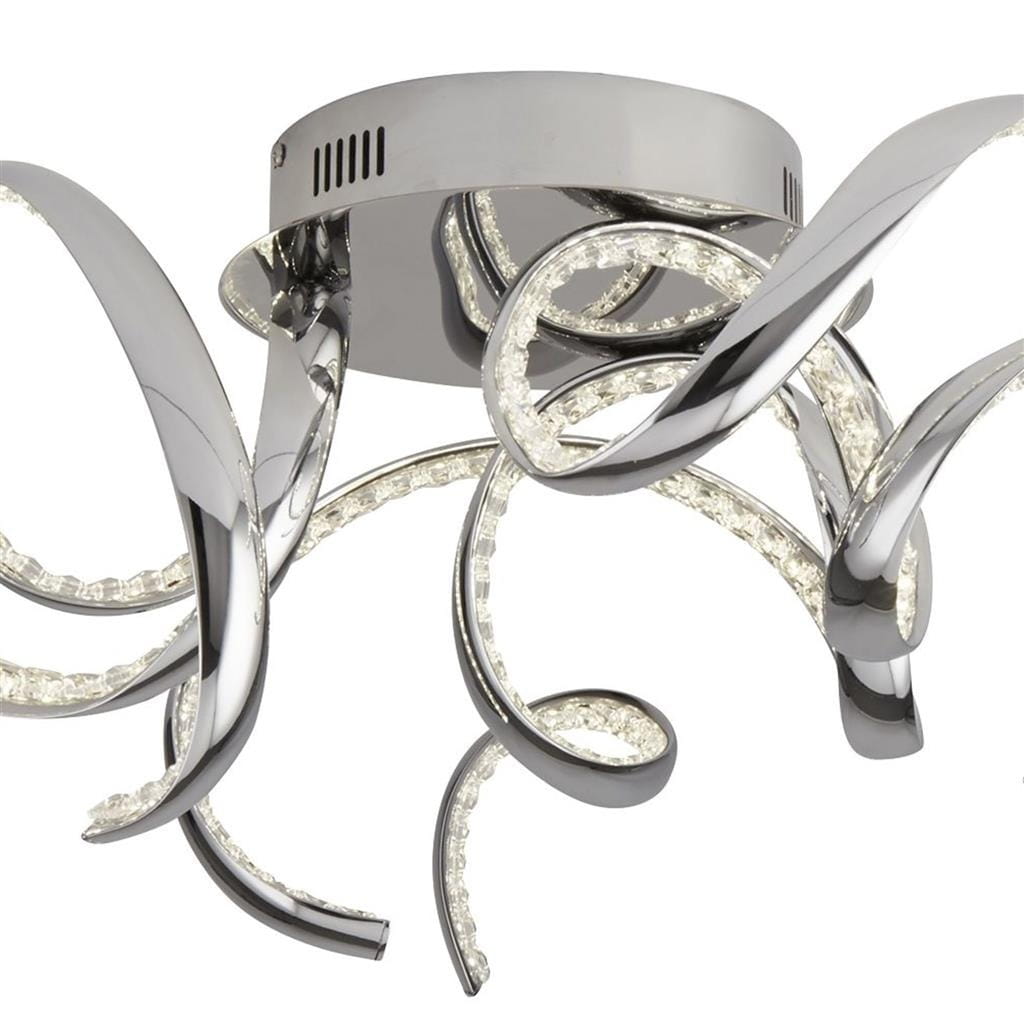 Lampa sufitowa Twirls LED 3-punktowa w chromie, z falującymi ramionami. Przeźroczyste elementy LED wbudowane w metalowe, błyszczące detale. Ujęcie z dołu, pokazujące kształt i położenie lampy.