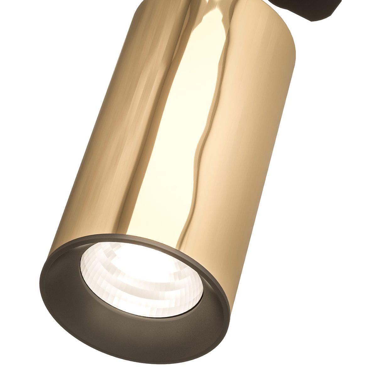 Reflektor spot Track Lea Gold w kolorze czarnym i złotym, o cylindrycznej formie. Widoczna lampa z okrągłym kloszem, z detalem w postaci tekstury na złotej powierzchni. Montaż na szynie, kąt ujęcia zbliżony na detal.