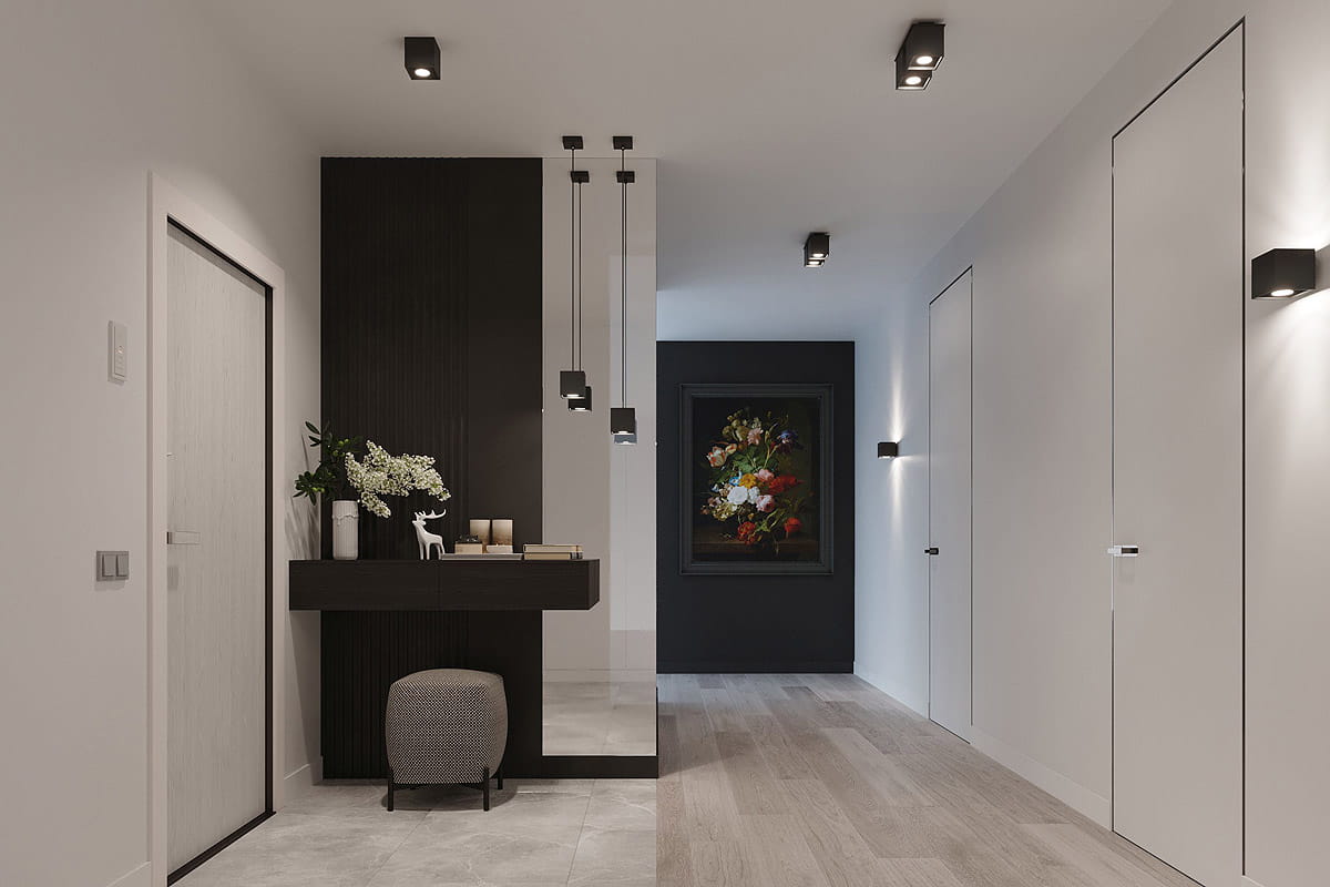 Czarna lampa sufitowa 1-punktowa Quad SL.0022, zamontowana na suficie w korytarzu. Prosta, kwadratowa obudowa z metalowym wykończeniem. Oświetlenie skierowane w dół, w otoczeniu jasnych ścian i nowoczesnych mebli.