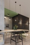 Lampa wisząca Orbis 1-punktowa w kolorze czarnym, o cylindrycznym kształcie, zawieszona na cienkim kablu. Widoczna w nowoczesnej aranżacji wnętrza z drewnianym stołem i roślinami w zielonych donicach. Tło w odcieniach szarości i czerni.