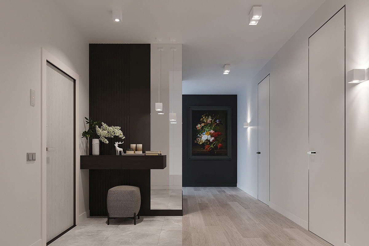 Biała, 2-punktowa lampa sufitowa Quad, zamontowana w korytarzu. Kąt ujęcia frontalny, widoczna prostokątna forma. Lampa emituje światło, oświetlając przestrzeń. W tle elegancka aranżacja z ciemną ścianą, obrazem i meblami.