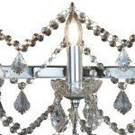 Lampa wisząca Florence 14-punktowa w chromie. Eleganckie, przezroczyste kryształy w kształcie kropli oraz świeczkowe źródła światła. Detale metalowe i dekoracyjne łańcuchy z kryształków, tworzące efektowną aranżację.