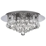 Lampa sufitowa Hanna 4-punktowa w kolorze chromu, okrągła, z kryształowymi dekoracjami. Zawieszone szklane kule tworzą efektowną kompozycję. Ujęcie z dołu, ukazujące detale i błyszczące wykończenie.