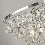Lampa wisząca Michelle 4-punktowa w chromie, z okrągłym metalowym ramieniem, zdobiona przezroczystymi, szklanymi kulkami w różnych kształtach. Widok z góry, akcentujące detale i blask kryształów.
