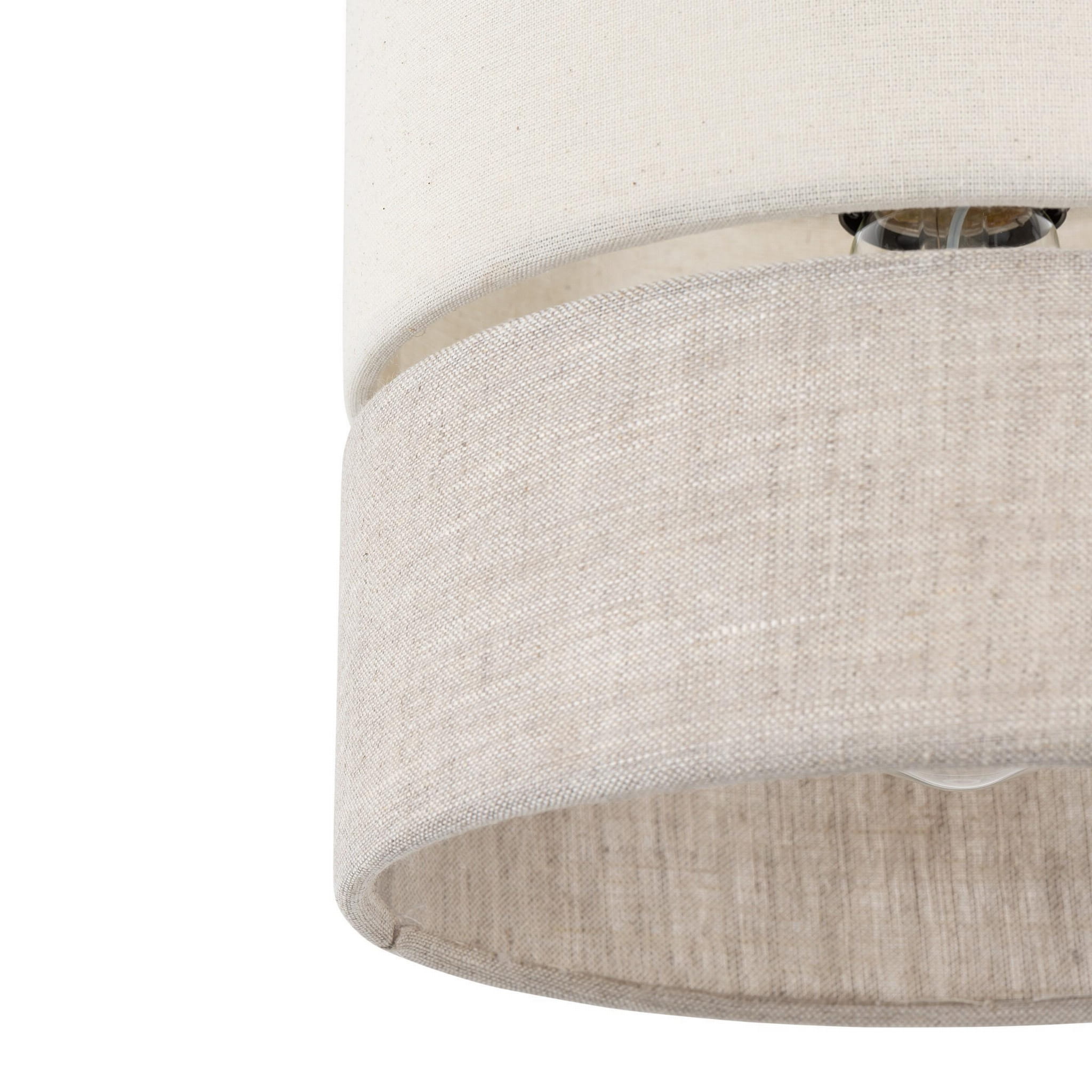 Lampa wisząca Eco D20 z jednopunktowym źródłem światła, wykonana z materiału w kolorze jasnego beżu. Okrągła, z tkaninowym kloszem, widoczny gwint żarówki. Ujęcie z dołu, ukazujące detal tekstury i wykończenia.
