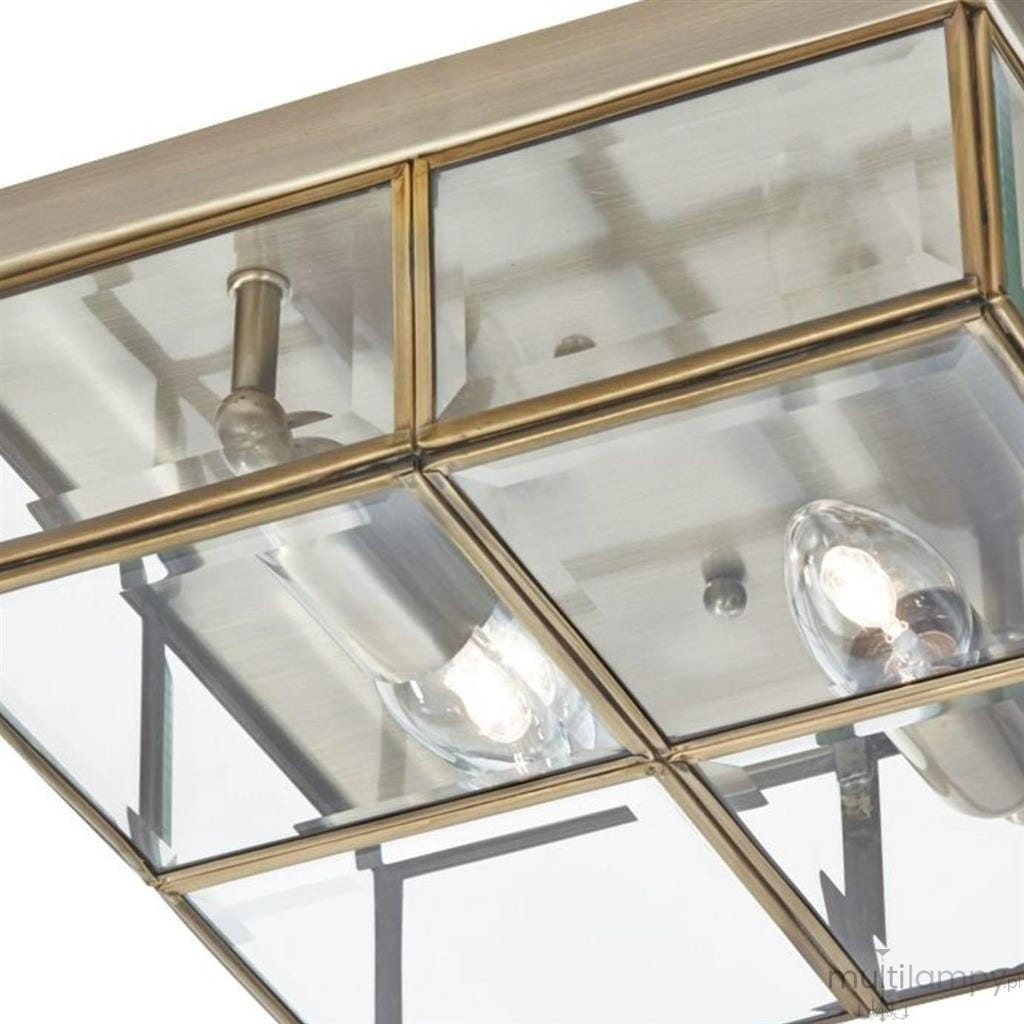 Lampa sufitowa 2-punktowa w antycznym mosiądzu, z przezroczystymi elementami szklanymi. Widok z dołu, ukazujący dwa żarówki i metalową konstrukcję, z wyraźnymi detalami w złotym odcieniu. Idealna do nowoczesnych wnętrz.