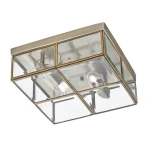Lampa sufitowa 2-punktowa w mosiężnej, antycznej oprawie z przezroczystymi szklanymi panelami, kwadratowa konstrukcja z widocznymi żarówkami, montowana na suficie.