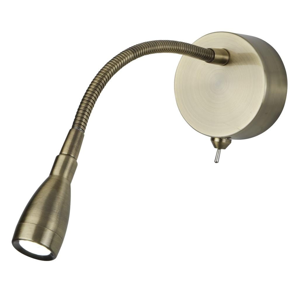 Kinkiet Flexy Wall LED w kolorze antycznego mosiądzu, z elastycznym ramieniem, skierowany w stronę ściany. Okrągła podstawa z wykończeniem metalicznym, z widocznym włącznikiem. Idealny do oświetlenia strefowego w różnych aranżacjach wnętrz.