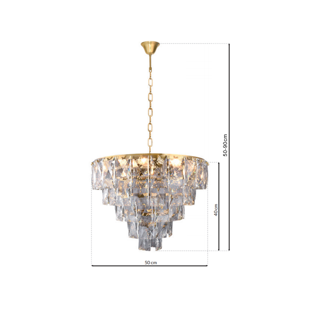 Lampa wisząca Chelsea 6-punktowa w kolorze złotym z kryształowymi elementami. Okrągły klosz o średnicy 50 cm, zawieszony na łańcuchu regulującym wysokość od 50 do 90 cm. Wysokość klosza to 40 cm, podkreślająca elegancki design.