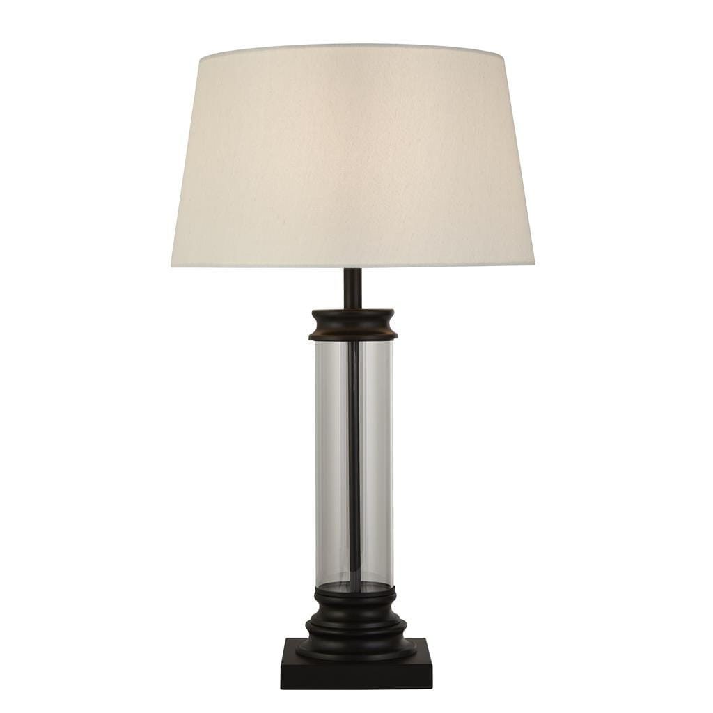 Lampa stołowa Pedestal 1-punktowa w kolorze czarnym i kremowym. Posiada przezroczystą, szklaną podstawę i stożkowy klosz z materiału. Ujęcie frontalne, stojąca na kwadratowej podstawie. Idealna do nowoczesnych wnętrz.