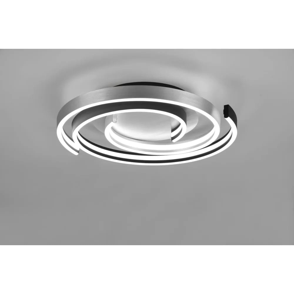 Caya LED lampa sufitowa 2-punktowa w kolorze aluminium i czarnym, o nowoczesnym, spiralnym kształcie. Ujęcie z góry, pokazujące dwa okręgi świetlne z białym podświetleniem na ciemnym tle. Idealna do nowoczesnych wnętrz.