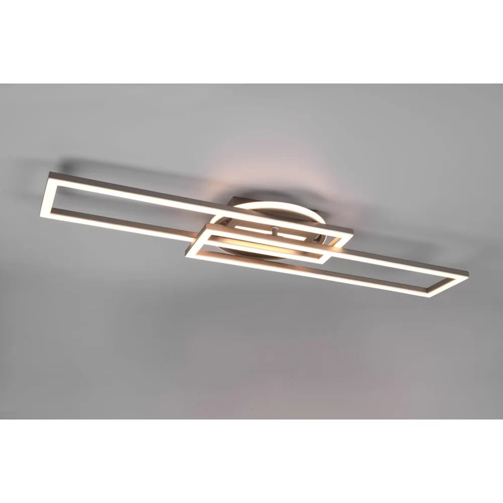 Lampa sufitowa Twister LED w kolorze niklowym z pilotem, o nowoczesnym, geometrycznym kształcie. Widziana z góry, z dwoma prostokątnymi ramkami, emitującymi ciepłe światło. Montaż na suficie, elegancki design, idealna do nowoczesnych wnętrz.