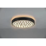 Plafon LED Chizu w kolorze czarnym, okrągły, z wycięciami w kształcie kropek. Emituje światło RGB, z możliwością sterowania pilotem. Zawieszony na suficie, z delikatnym podświetleniem wokół, idealny do nowoczesnych wnętrz.