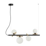 Lampa wisząca Reverso 4-punktowa w kolorze czarnym z dodatkami złotymi. Posiada cztery okrągłe klosze z mlecznego szkła, zamontowane na poziomej, czarnej listwie. Kąt ujęcia frontalny, produkt zwisający z sufitu.