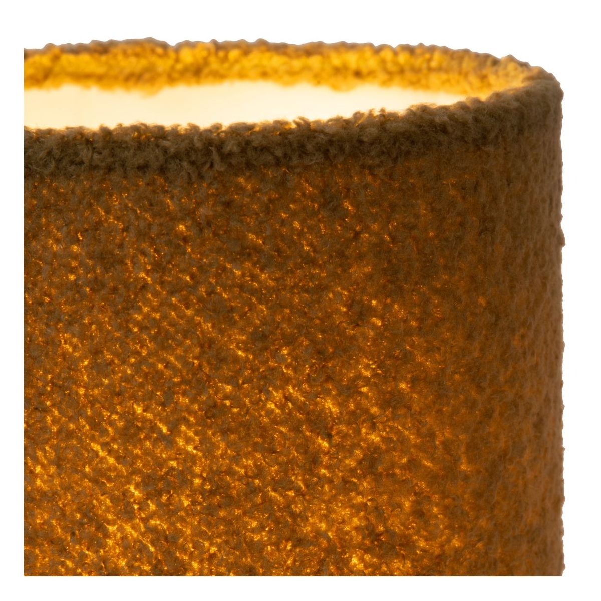 Zielona lampa stołowa Woolly 1-punktowa o cylindrycznym kształcie, pokryta teksturowanym materiałem. Widoczny fragment klosza z delikatnym, ciepłym podświetleniem. Idealna do nowoczesnych wnętrz, prezentowana w zbliżeniu.